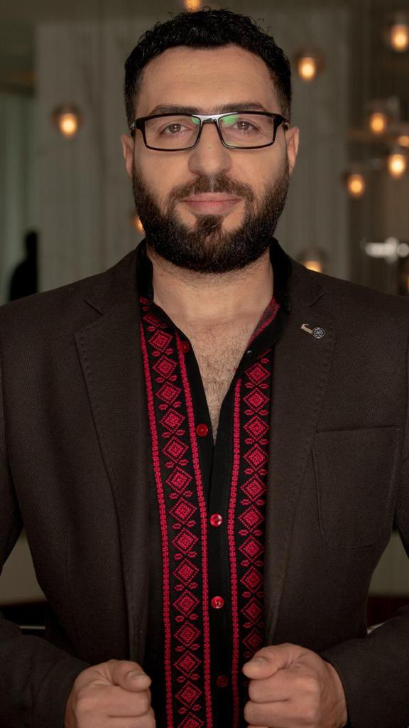 Hand-Embroidered Black Men’s Shirt – Traditional Red Palestinian Patterns